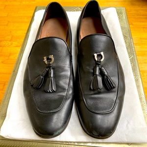 Ferragamo loafers. Black with tassels and silver logo hardware.